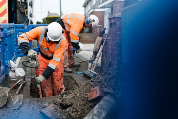 workers digging up the ground